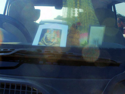 picture of Upasni Maharaj on our inside windshield