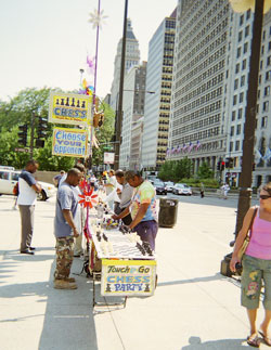buskers: colorful "Chess Party" booth  along Michigan Ave