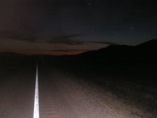 highway stretching into night (the unknown) w just a touch of sunrise: Nevada