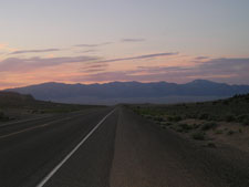 highway disappears into nevada sunrise