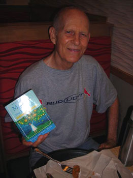 Jim Bourne, holding up his book for the camera