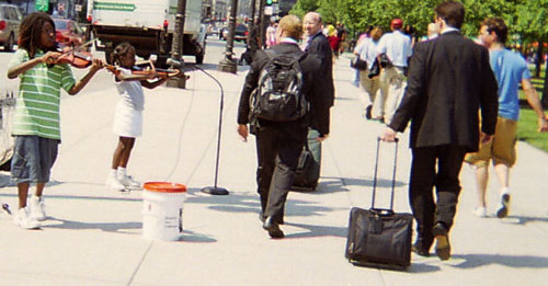 young violinist buskers along Michigan Avenue